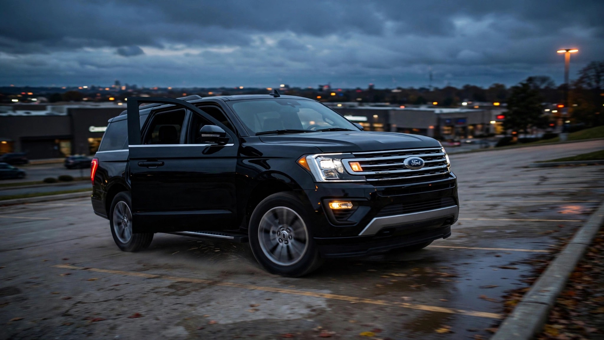 A black Ford Expedition parked at dusk in an empty parking lot with the driver's door ajar