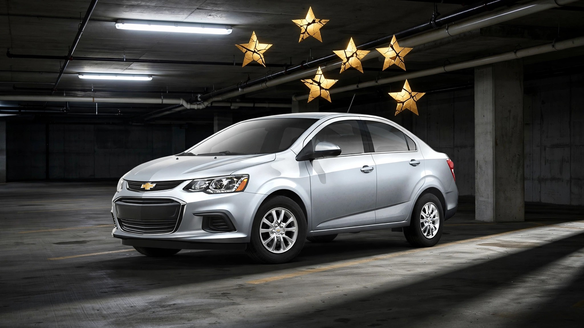 Chevrolet Sonic in parking garage with fractured stars overhead